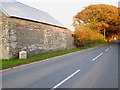 Milestone beside the B3257 at Plusha in PL15 7QS