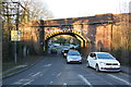 Arch bridge taking railway over A321 in RG40 3EU