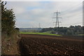 Ploughed field and power lines in CO10 7LT