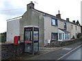 Elizabeth II postbox and telephone box on the A6, Clifton in CA10 2EP