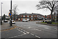 Mini-roundabout and shops on Worsley Road in M27 0EJ