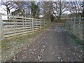 Farm track goes east from footpath crossing in RH13 6RE