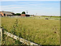Mill Farm buildings and fields in NR29 4LP