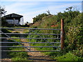 Gateway to track at rear of Mill Farm in NR29 4LP