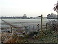 Gate and signpost to a frosty field path in NG23 7LY