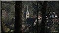 Clevedon - All Saint's Church as seen through trees on Strawberry Hill in BS21 6AA