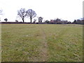 Footpath crosses field to Sandygate Lane in RH13 6NF