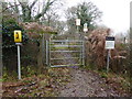 Bridleway approaches level crossing with telephone in RH13 0NN
