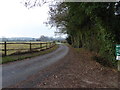 Footpath goes southwards on farm road in RH13 0NA