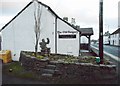 Stone man beside The Old Surgery in FK8 3LX