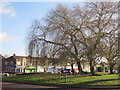 Roundabout and shops at Tarbock Road in L36 5UL