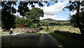 Country lane by Gorsty Low near Milton Chapel with view towards South Head in SK12 6QJ