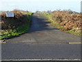 Private road goes west from the B2118 in Downland Villages Ward