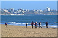 Walkers on the beach in BH13 7JD