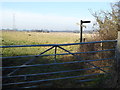 Signpost and field gate near Westmill Farm in BN5 9YH