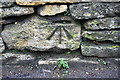 Benchmark on Dry Lane wall opposite Waterside Cottage in OX29 9TF