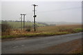 Electricity power lines crossing single track road from Minster Lovell in OX29 9TL