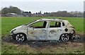 Burnt out car at Mowmacre Hill, Leicester in LE4 3AD