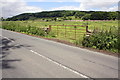 View through field gateway towards Wensleydale Railway in DL8 4AG