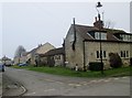 Cottages at the junction of the High Street and The Green in YO62 4AQ