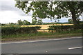 Fenced former field gateway beside A684 west of Middlefields Farm in DL8 5NG
