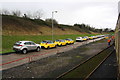 Parked cars viewed from charter train beside the Portbury Coal Terminal in BS20 9XP