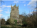 Cottage and west tower of St. Mary and All Saint's church in NG34 8TH