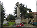 The war memorial and St Mary's Church, Chigwell in IG7 6QX
