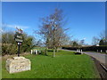 Village sign and small green in West Dereham in PE33 9TU