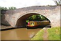 Narrowboat emerging under Bremilow's Bridge in CW5 6AU