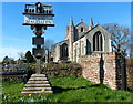 Village sign and church in PE34 3DH