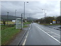 Bus stop and shelter on the A803 near Burnside Cottage in G66 8AP