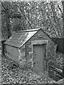 Hut with a Chimney, Longcross Churchyard in KT16 0DY