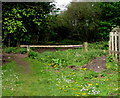 Wooden barrier across a track into Millrough Wood, Lydney in GL15 5SE