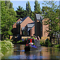 Narrowboat and housing near Brereton, Staffordshire in WS15 1BZ