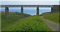Masonry piered railway bridge over burn north of Muchalls, Kindardineshire in AB39 3RD