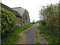 Footpath goes southwards by buildings at Great Strudgate Farm in RH17 6RB