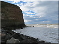 The bulk of Cowbar Nab from Staithes harbour breakwater in TS13 5BY