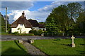 Thatched cottage opposite the church at Lytchett Minster in BH16 6BA
