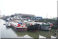 View of boats moored on the Roding at Town Quay in E6 2PU