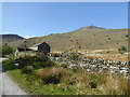 Approaching a barn below the hills in LL55 4YQ
