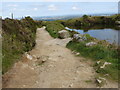 Track and flooded quarry on Carn Marth in TR16 5TS