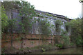 Derelict railway workshops by the Grand Union canal in MK12 5LJ