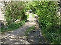 Track passing Winter Royd near Clough Hole in HX7 8PH