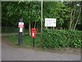 Elizabeth II postbox on Golf Links Road, Wymondham College in Morley St Botolph