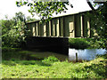 View of Ingworth Bridge across the river Bure from footpath in Ingworth