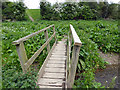Footbridge across River Perry in SY10 7AS
