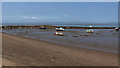 Grounded boats and a breakwater in LA4 5BG