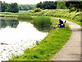 A lone fisherman on the Leeds to Liverpool Canal in L23 9SE