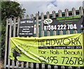Adverts on a Gelli Road gas installation perimeter fence, Tredegar in NP22 4NR